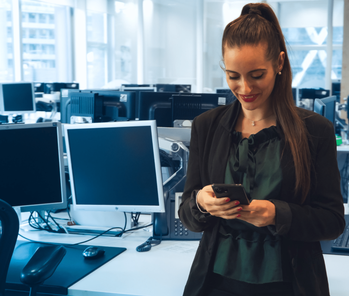 financial services employee holding an iphone