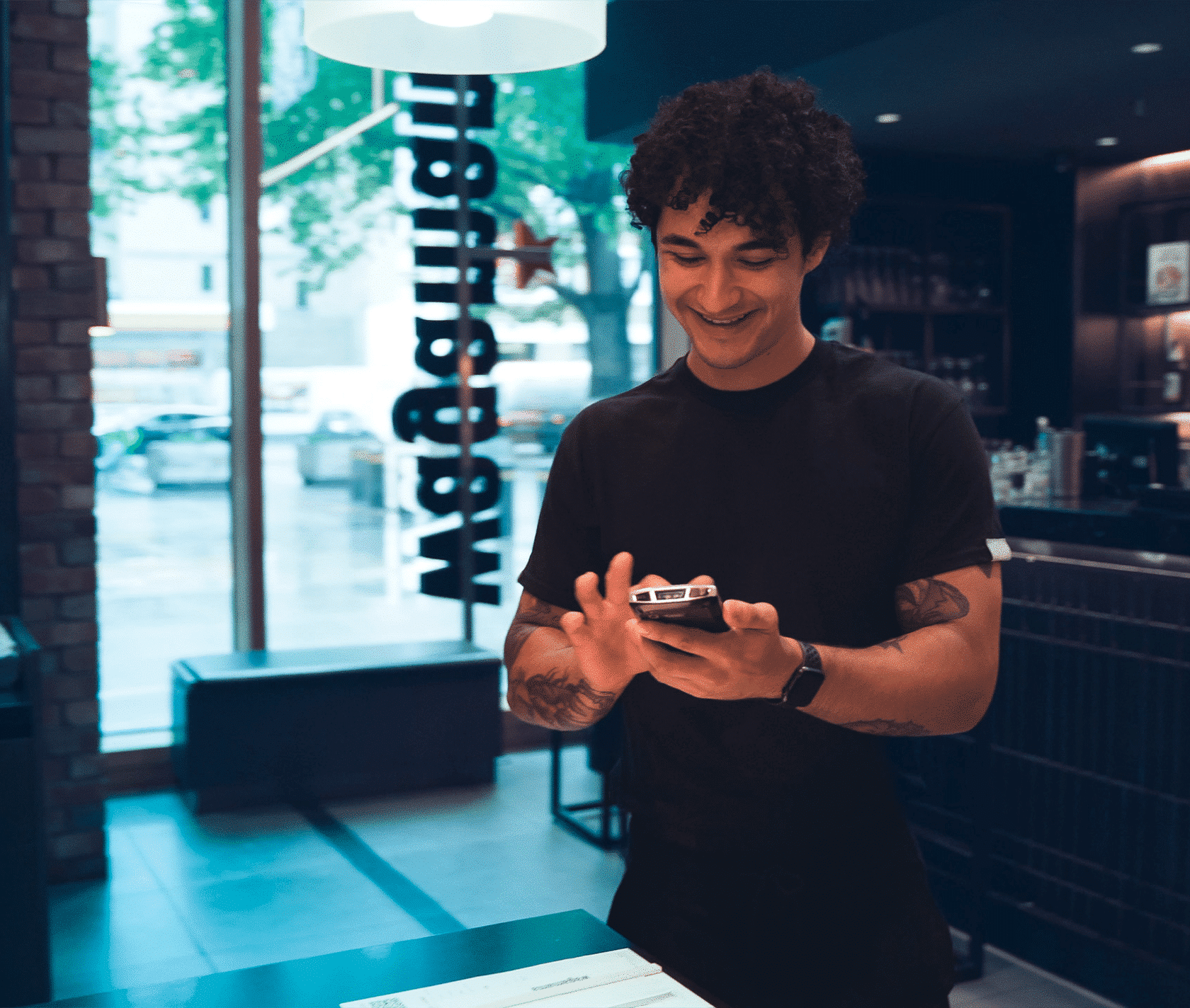 a man playing a franchise training on his mobile phone