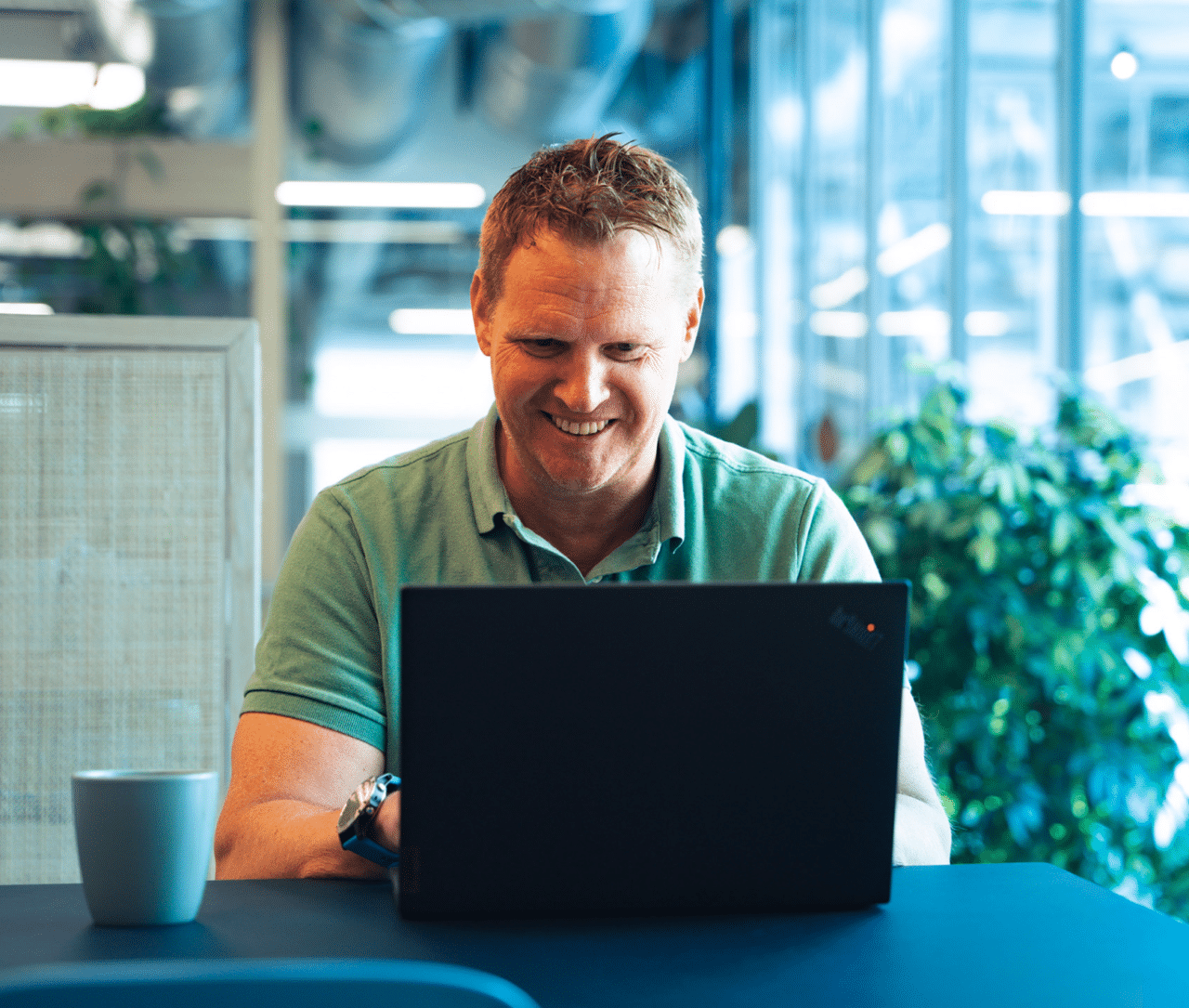 a man employee playing attensi soft skills training on his computer